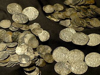 silver coins on black cloth