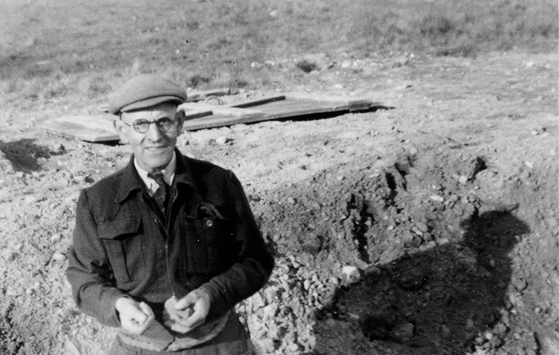 black and white photo of basil standing in trench