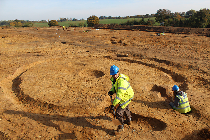 excavation site at Easton with two people excavating a round house