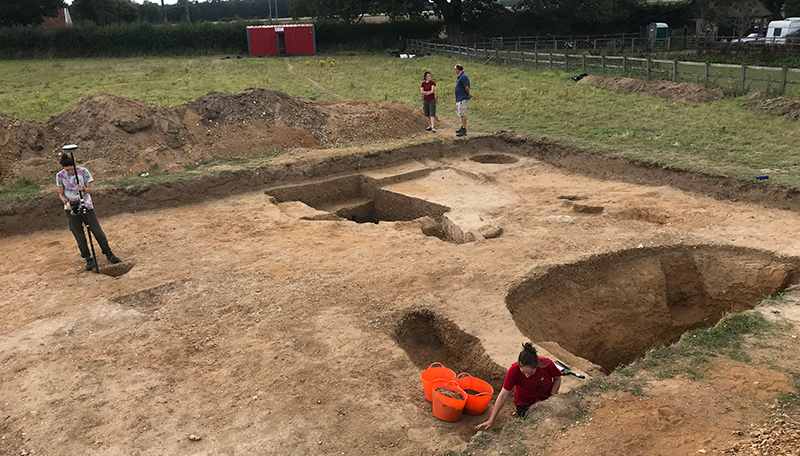 trench with people excavating features