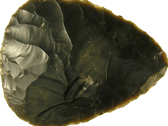 a handaxe made of dark flint