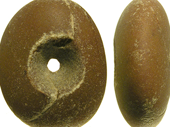 showing two sides of a pebble mace, in brown coloured stone with a hole in the middle