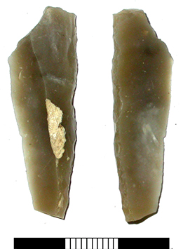 a broken retouched grey flint point, 4.5cm in length