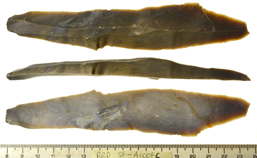 a Long grey flint blade (16cm in length) with a flake scar running along the dorsal side