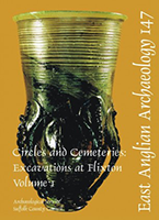 front cover with photo of green glass claw beaker