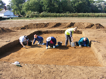 people excavating an archaeological site